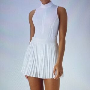 MEDIUM.   HALARA  SLEEVELESS CUT OUT 2 IN 1 PLEATED MINI TENNIS DRESS